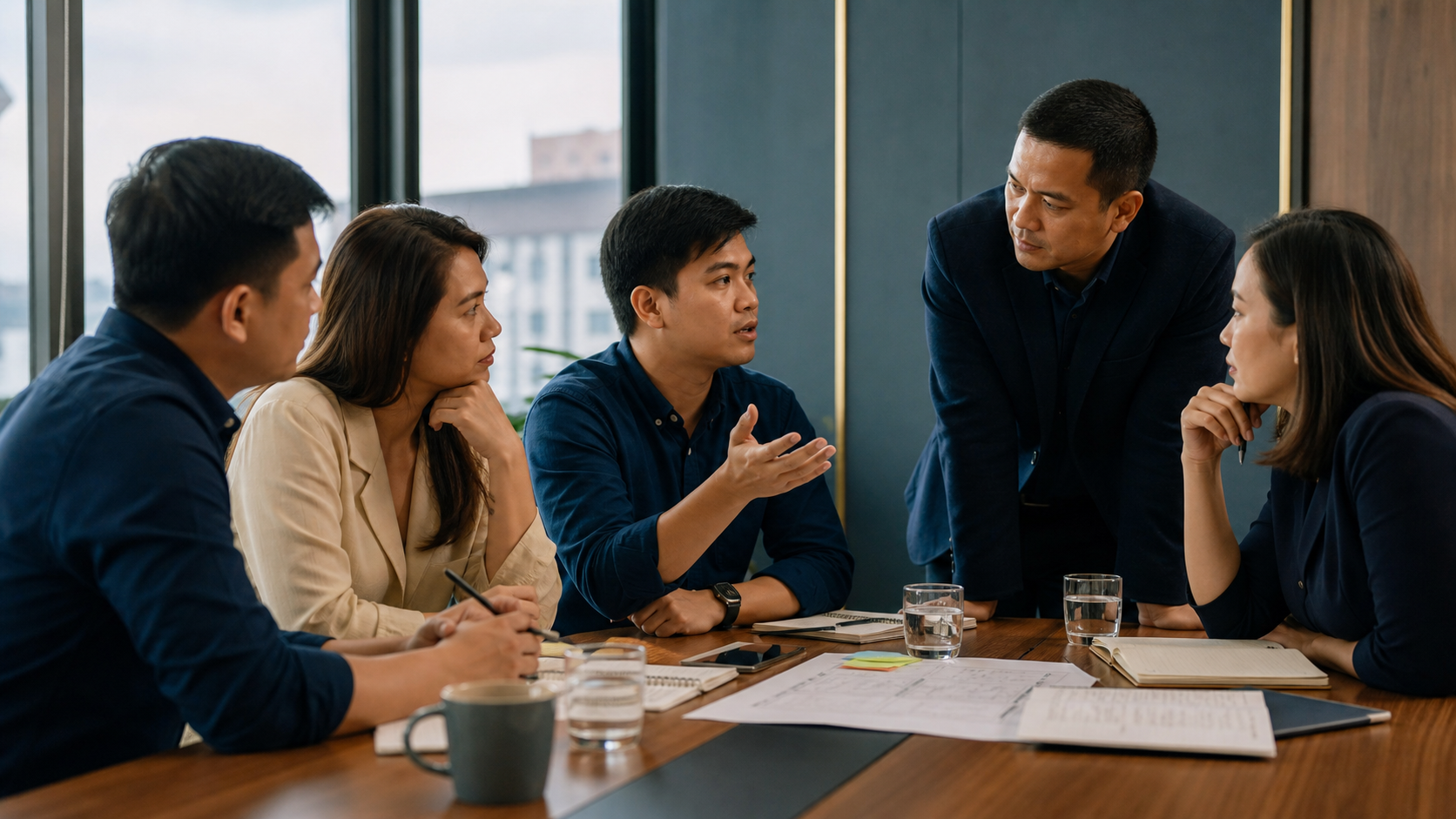 Filipino team discussing a minority opinion in a psychologically safe workplace