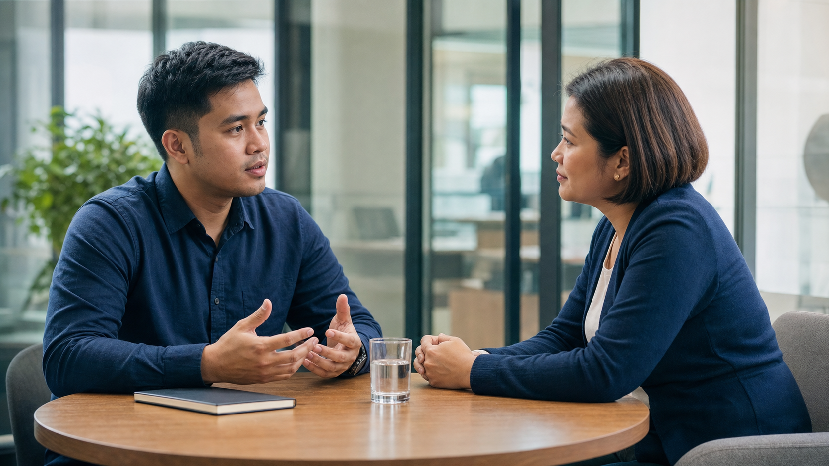 Filipino employee having a private and respectful conversation with a manager